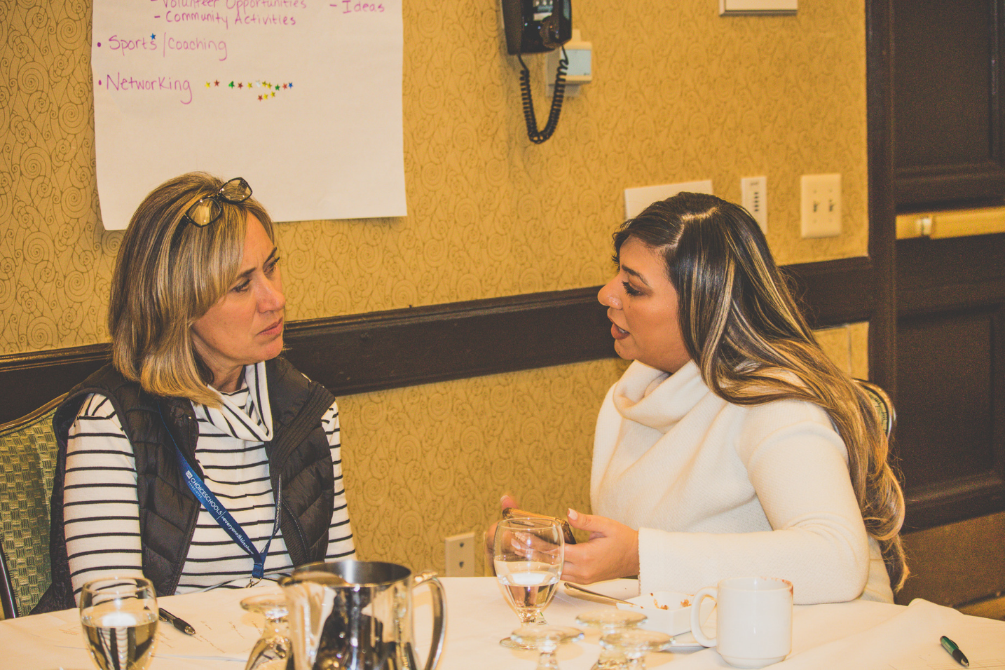 A photo of two #MiCSS18 attendees collaborating in a session.
