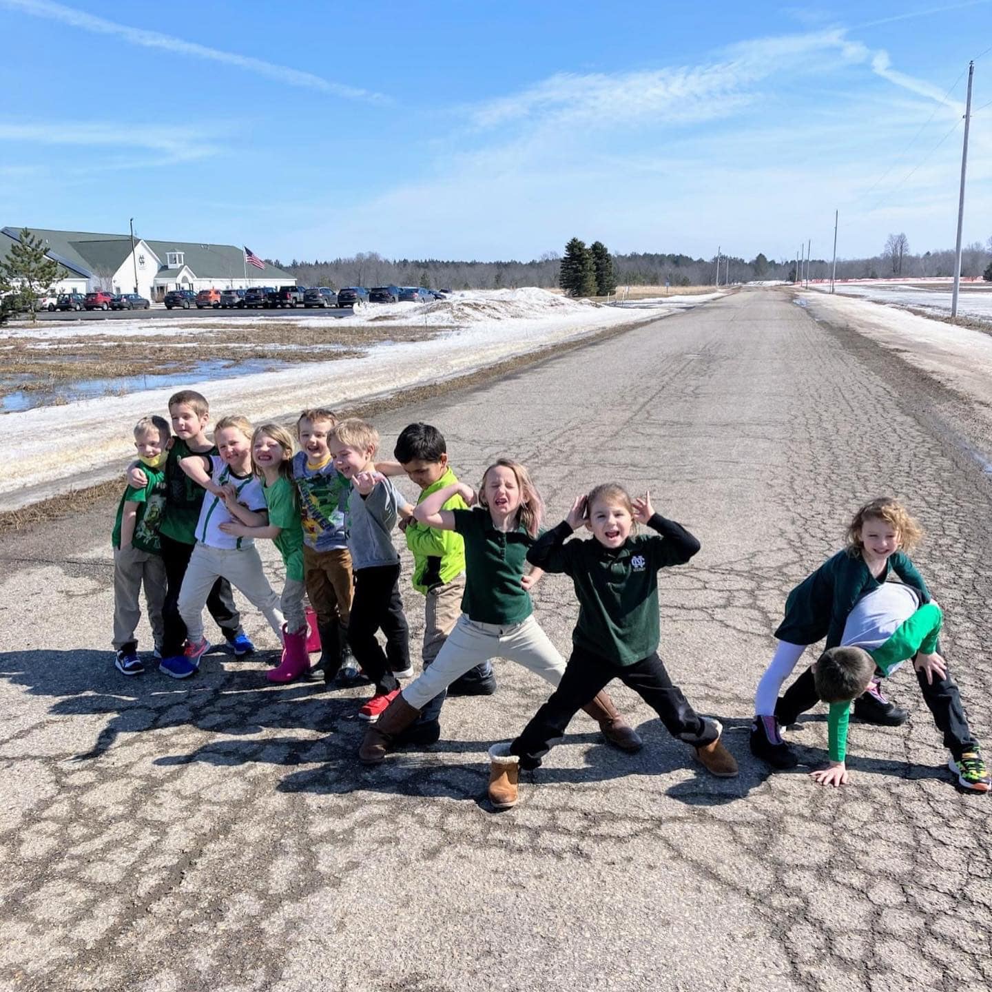 Students pose outside during a school day break. 