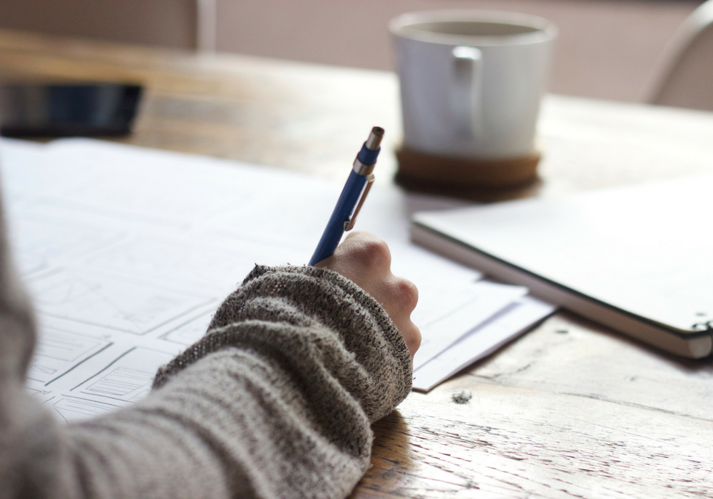 A photo of someone writing. 