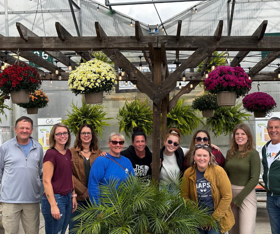 MAPSA Team members posing with plants and flowers