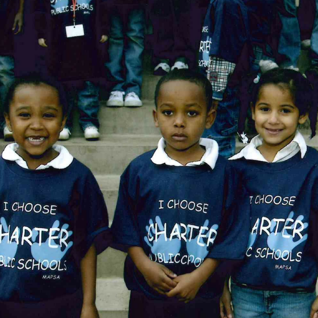 A historic photo of three young charter school female students.