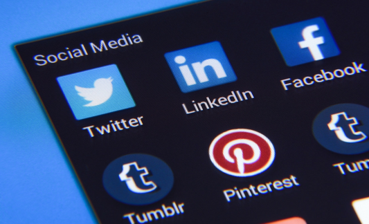 A photo of several social media icons, including Facebook, Twitter, LinkedIn, Tumblr and Pinterest.