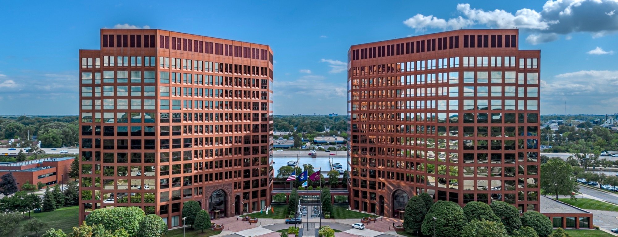 The twin bronze-glass towers of the Columbia Center on West Big Beaver Road in Troy, Michigan, seen from the air on a clear day