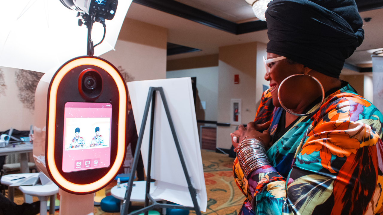 Attendee taking photos at photo booth