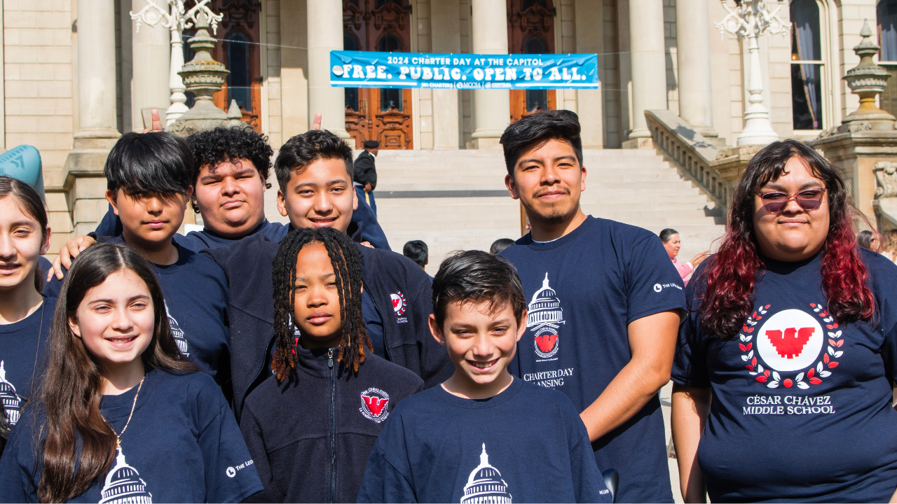 Students posing in front of Michigan Capitol Steps
