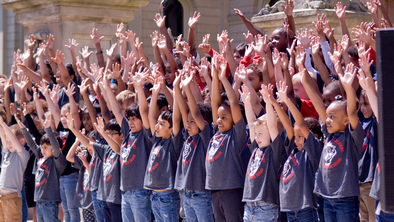 Elementary students singing on Michigan Capitol Steps