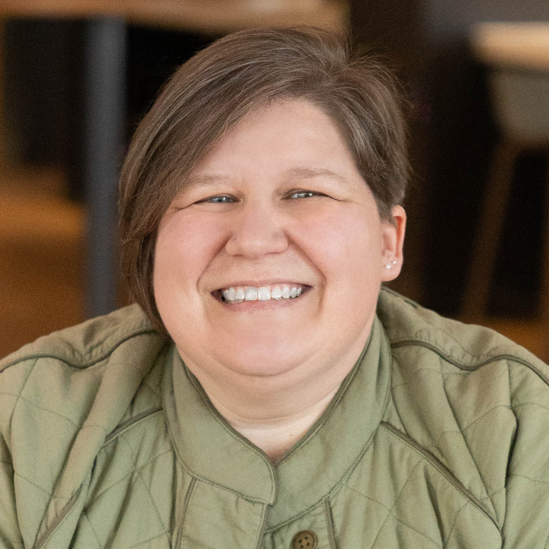 KimRowlandHeadshotSquareOranger