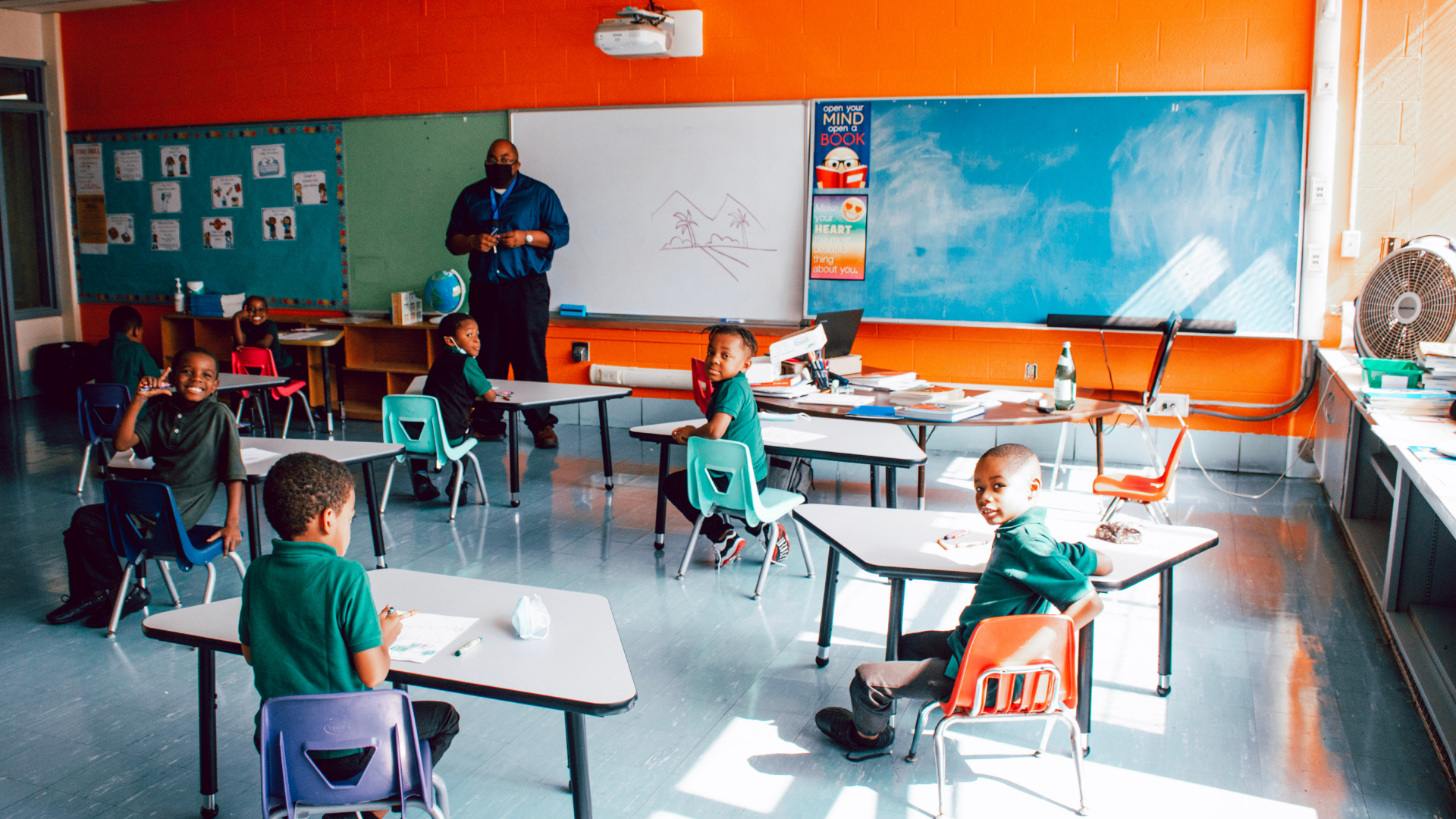 A group of students sit in their classroom at Barack Obama Leadership Academy